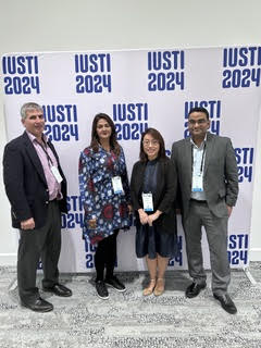 Dr. Ahuja networking at a conference
