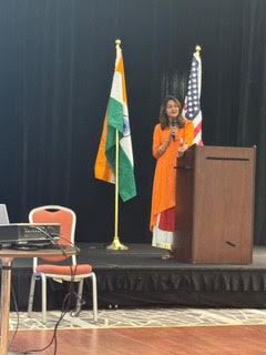 Dr. Ahuja speaking at industry event